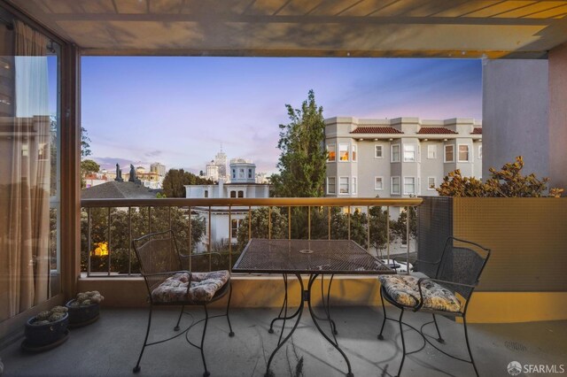 view of balcony at dusk