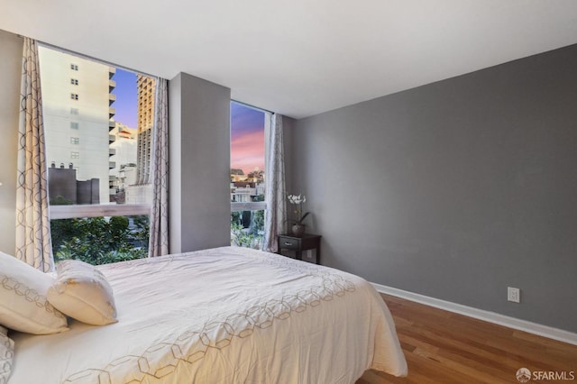 bedroom with wood-type flooring