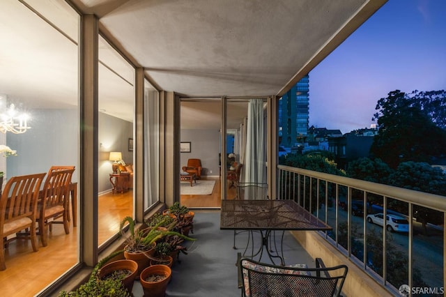 view of balcony at dusk