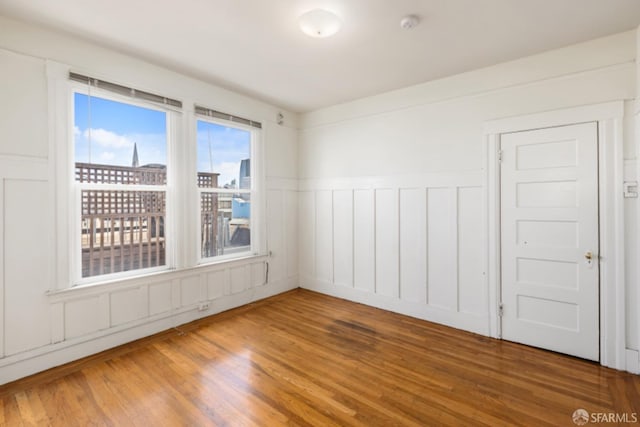 unfurnished room featuring hardwood / wood-style floors