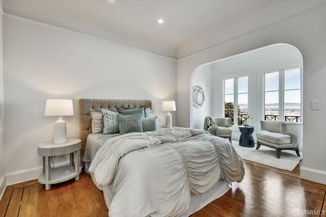 224 Twin Peaks Blvd, San Francisco, CA 94114 - bedroom featuring arched walkways, recessed lighting, and wood finished floors