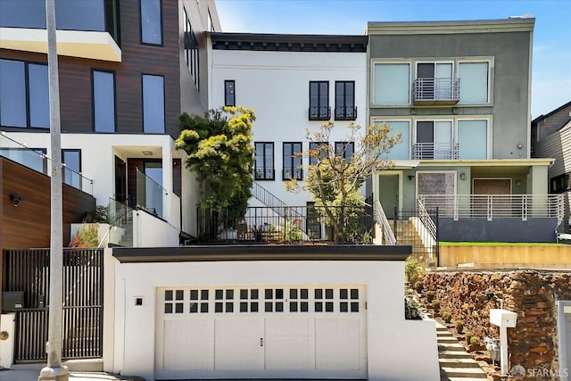 224 Twin Peaks Blvd, San Francisco, CA 94114 - view of front of property featuring stucco siding, stairs, and concrete driveway