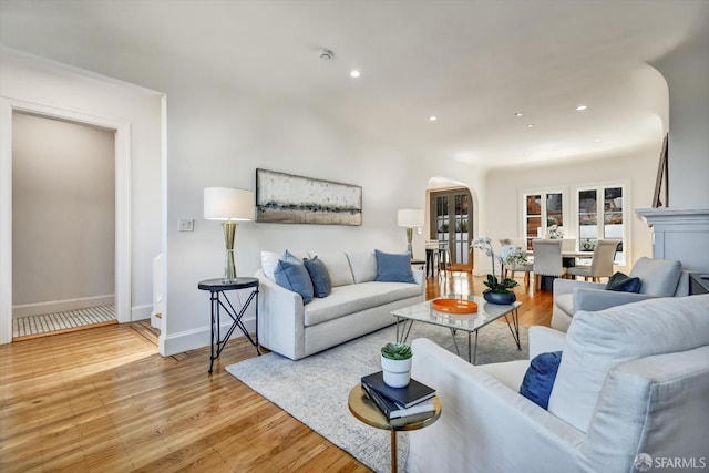 224 Twin Peaks Blvd, San Francisco, CA 94114 - living room with arched walkways, light wood-style flooring, and recessed lighting