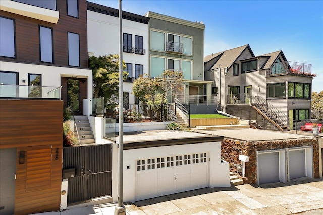 224 Twin Peaks Blvd, San Francisco, CA 94114 - view of front of home with stairway, stucco siding, and a garage