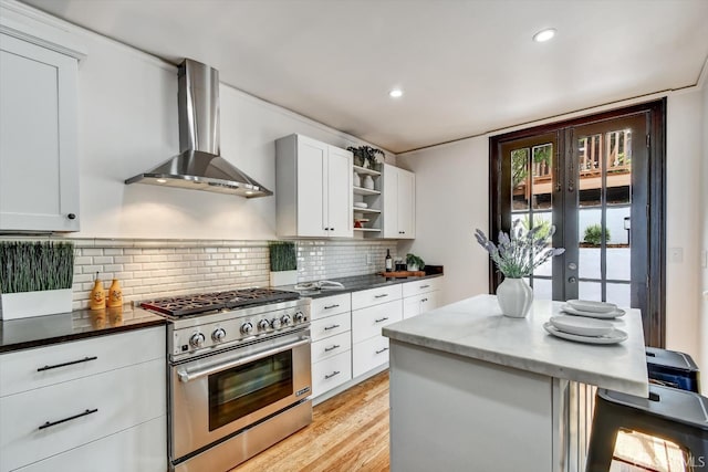 224 Twin Peaks Blvd, San Francisco, CA 94114 - kitchen with high end range, wall chimney exhaust hood, open shelves, recessed lighting, and light wood finished floors