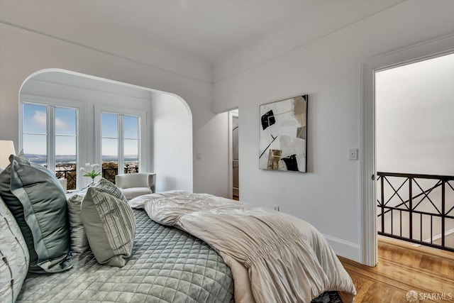 224 Twin Peaks Blvd, San Francisco, CA 94114 - bedroom featuring arched walkways and wood finished floors