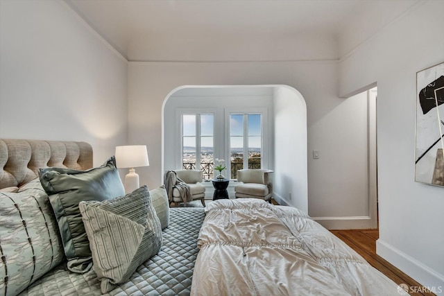 224 Twin Peaks Blvd, San Francisco, CA 94114 - bedroom with arched walkways and wood finished floors