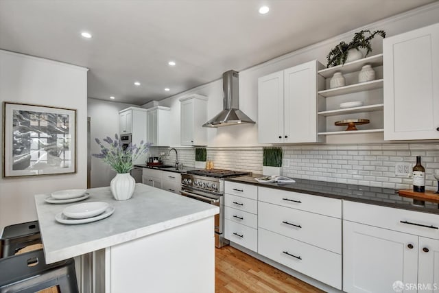 224 Twin Peaks Blvd, San Francisco, CA 94114 - kitchen with high end range, wall chimney exhaust hood, open shelves, white cabinets, and tasteful backsplash