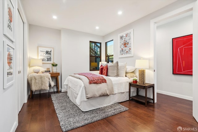 bedroom with dark wood-type flooring