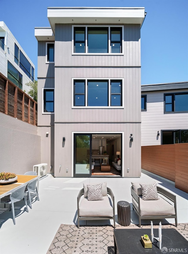 back of house featuring an outdoor hangout area and a patio