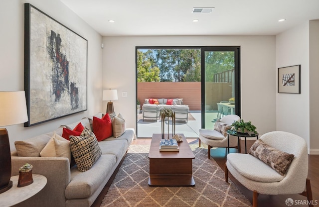 living room with dark hardwood / wood-style flooring