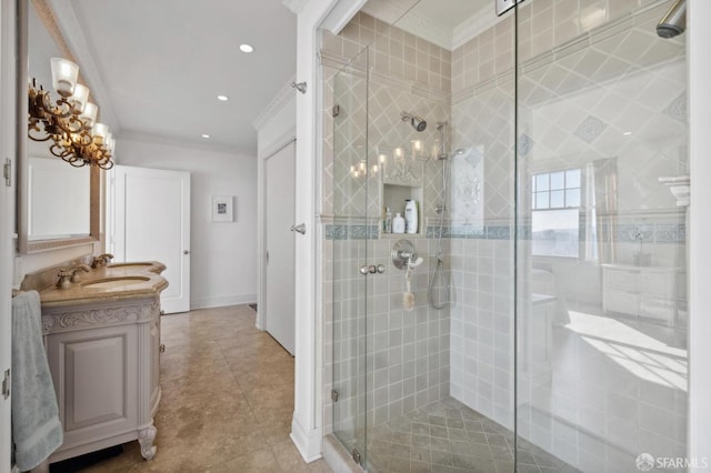 bathroom featuring ornamental molding, an enclosed shower, and vanity