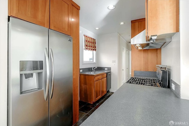 kitchen with brown cabinets, stainless steel appliances, recessed lighting, a sink, and under cabinet range hood