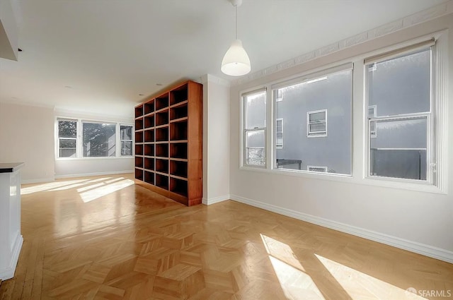 spare room featuring baseboards