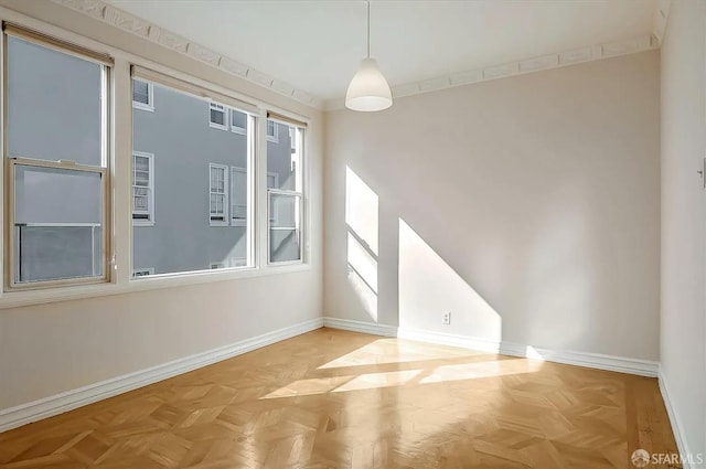 unfurnished room featuring visible vents and baseboards