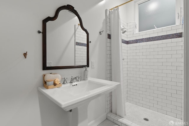 bathroom featuring sink and a shower with shower curtain