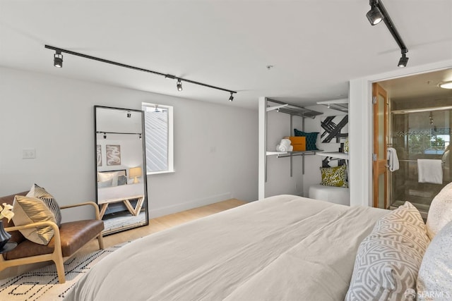 1207 Indiana St Unit 10, San Francisco, CA 94107 - bedroom featuring wood finished floors, rail lighting, and baseboards