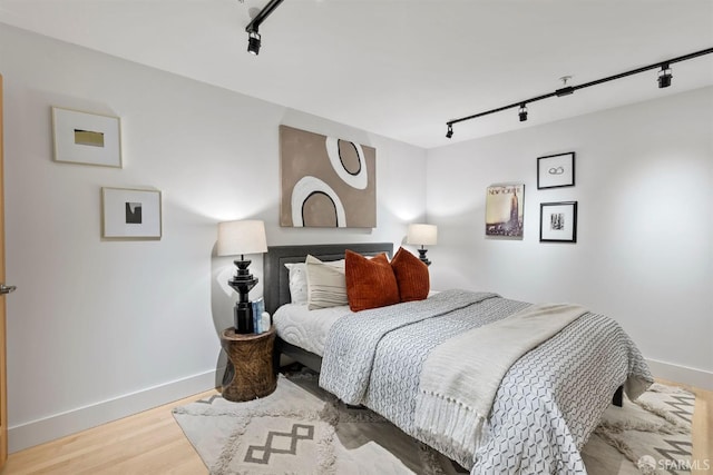 1207 Indiana St Unit 10, San Francisco, CA 94107 - bedroom featuring track lighting, baseboards, and wood finished floors