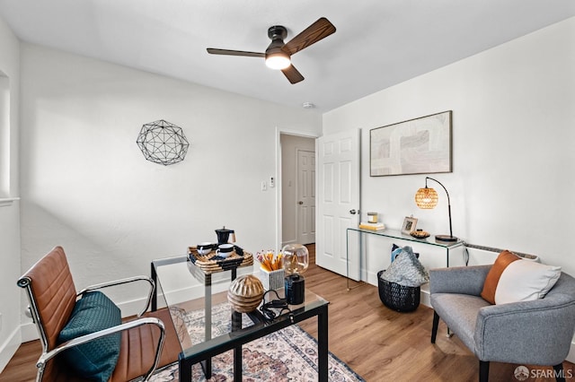 office area with ceiling fan and hardwood / wood-style floors