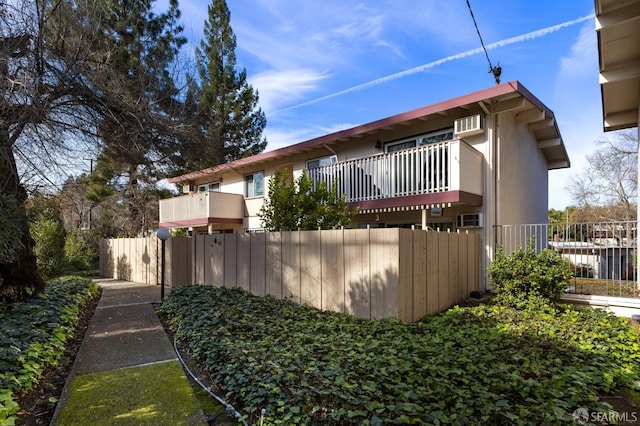 view of home's exterior with a balcony