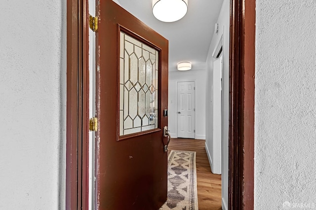 doorway to outside with hardwood / wood-style flooring