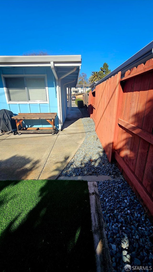 view of property exterior with fence