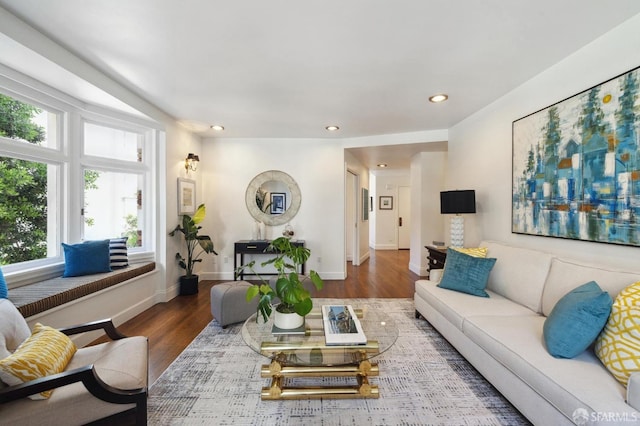 living room featuring recessed lighting, wood finished floors, and baseboards