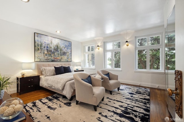 bedroom with recessed lighting, baseboards, and wood finished floors