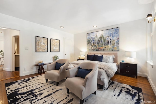 bedroom featuring recessed lighting, wood finished floors, and baseboards