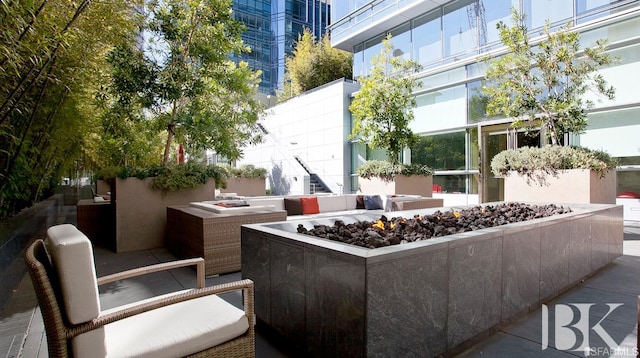 view of patio / terrace featuring a fire pit