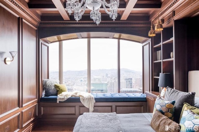 bedroom featuring coffered ceiling, crown molding, and multiple windows