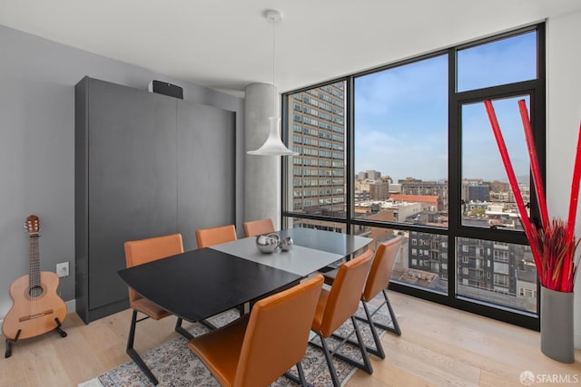 1545 Pine St Unit 1201, San Francisco, CA 94109 - dining space with floor to ceiling windows, wood finished floors, and a view of city