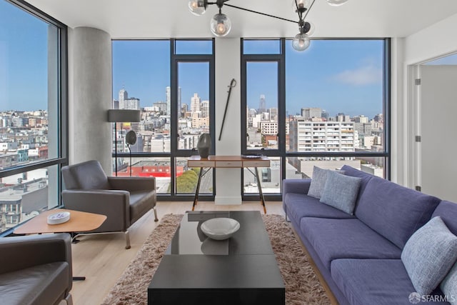 1545 Pine St Unit 1201, San Francisco, CA 94109 - living area featuring a skyline view, a wall of windows, and wood finished floors