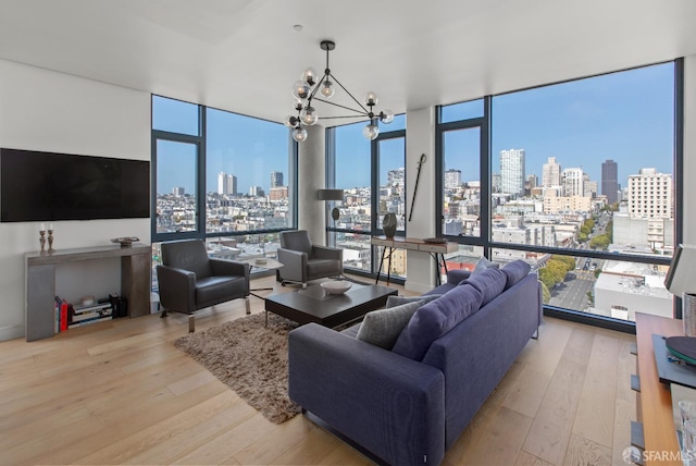 1545 Pine St Unit 1201, San Francisco, CA 94109 - living room featuring expansive windows, hardwood / wood-style floors, a chandelier, and healthy amount of natural light