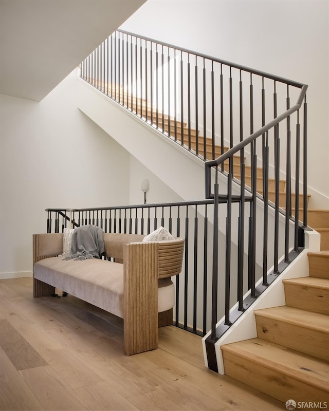 stairway with wood-type flooring