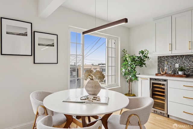 246 Ralston St, San Francisco, CA 94132 - dining area with beverage cooler, a bar, and light wood-type flooring