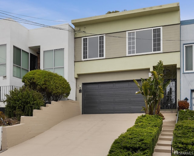 246 Ralston St, San Francisco, CA 94132 - view of front of property with stucco siding, a garage, and driveway