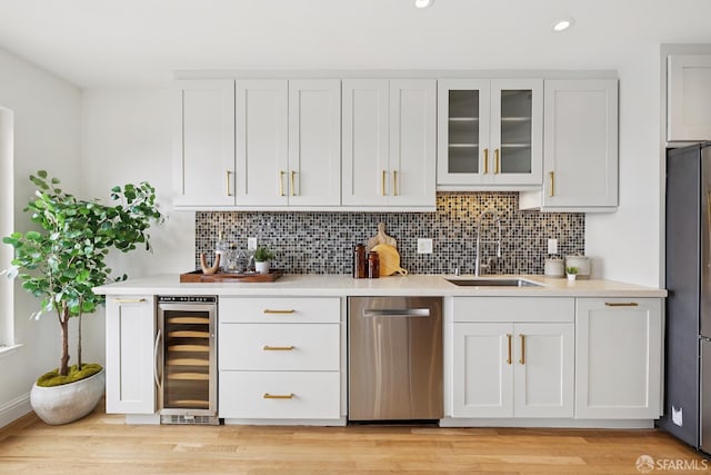 246 Ralston St, San Francisco, CA 94132 - bar area featuring stainless steel dishwasher, wine cooler, backsplash, recessed lighting, and fridge