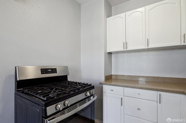 kitchen featuring white cabinets and stainless steel gas stove