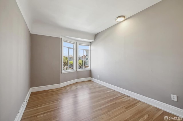 empty room with light wood-type flooring