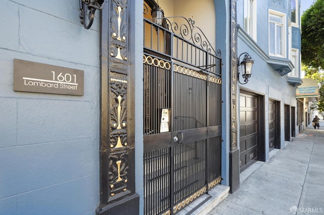 view of exterior entry with a garage