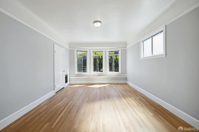 spare room with hardwood / wood-style floors