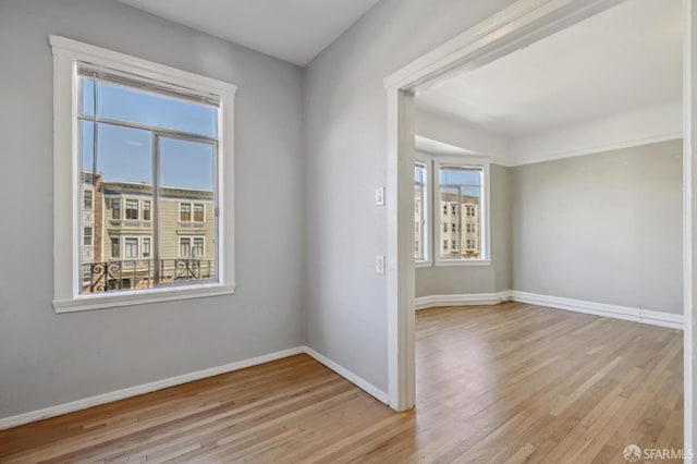 empty room with light wood-type flooring