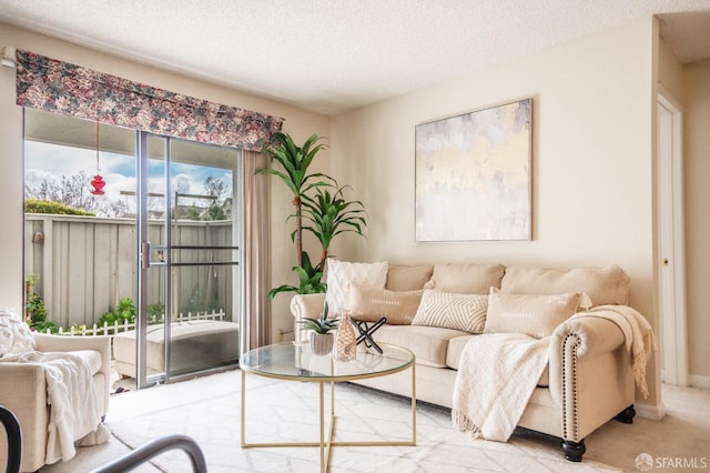 living room featuring a textured ceiling and carpet floors