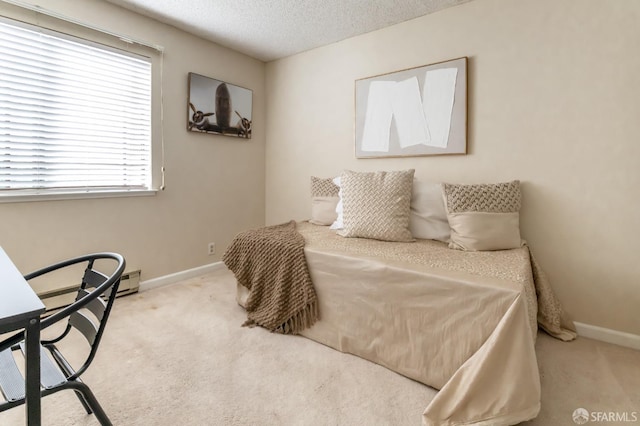 carpeted bedroom with a textured ceiling