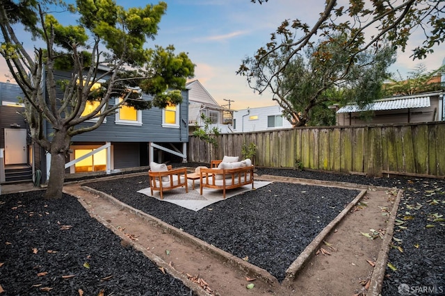 fenced backyard featuring outdoor lounge area and a patio