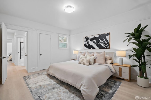 bedroom with light wood finished floors