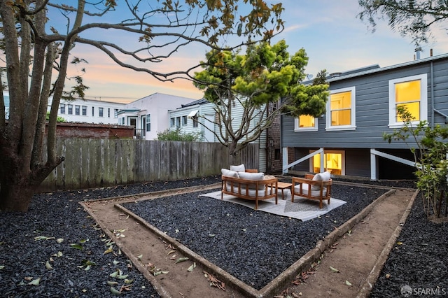 view of yard with outdoor lounge area, fence, and a patio