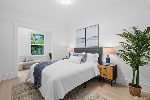 bedroom with wood finished floors