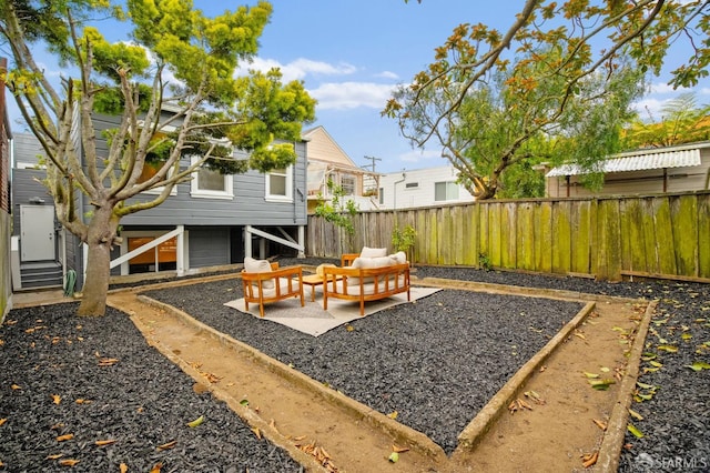 fenced backyard with an outdoor hangout area and a patio